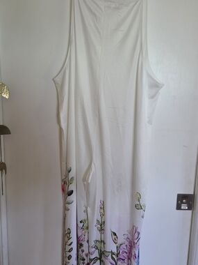 Sleeveless White jumpsuit with Floral Hem